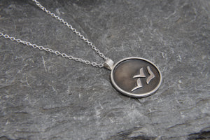 Soaring High Against Dark Clouds Necklace