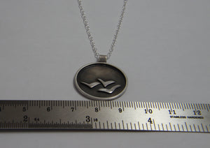 Soaring High Against Dark Clouds Necklace