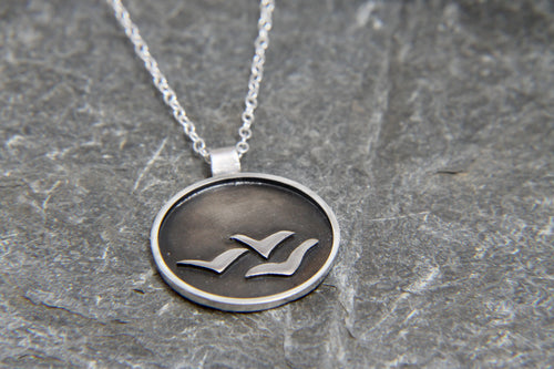 Soaring High Against Dark Clouds Necklace