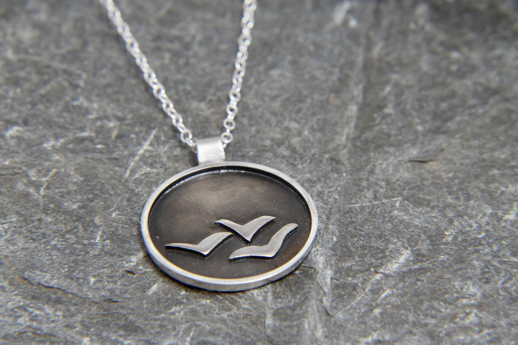 Soaring High Against Dark Clouds Necklace