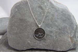 Soaring High Against Dark Clouds Necklace